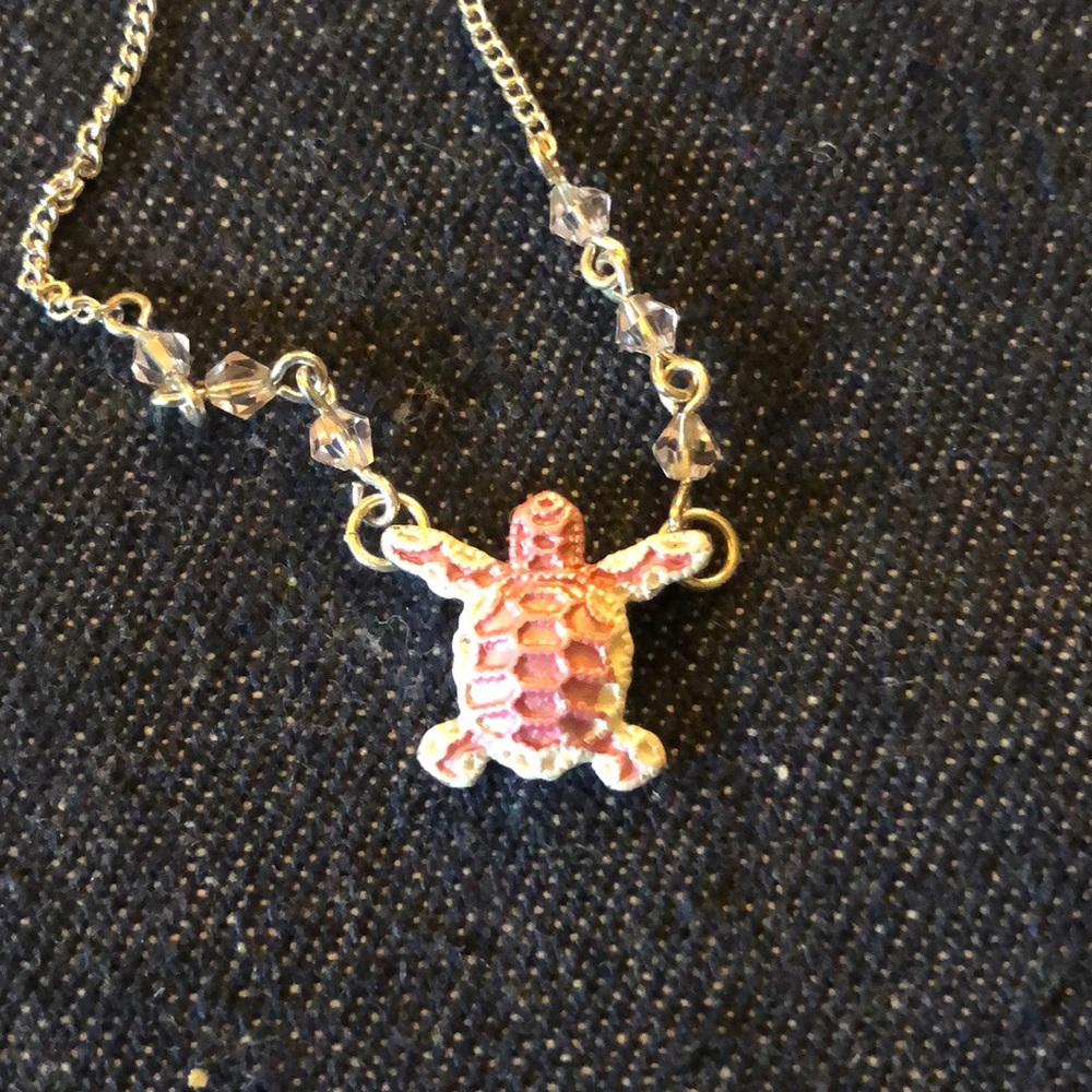 Pink turtle in a silver like chain
